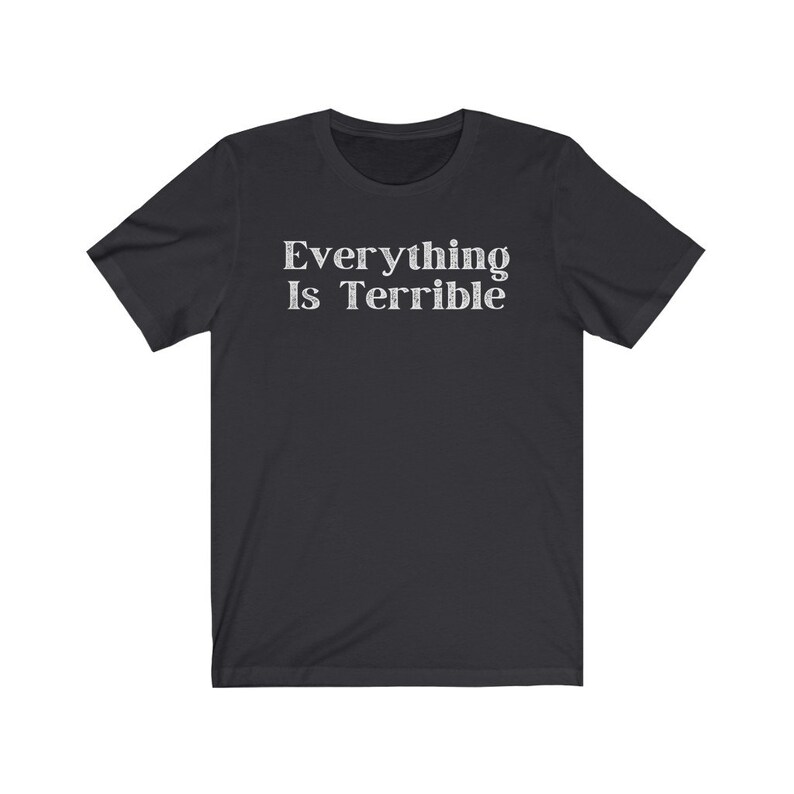May include: A black short-sleeved t-shirt with the text "Everything Is Terrible" printed in white on the front.