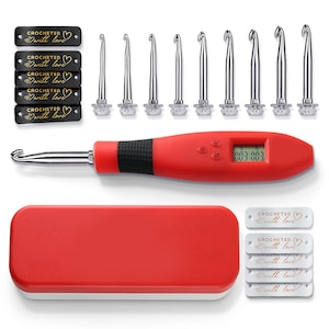 May include: A crochet hook set with a red handle and digital display, accompanied by multiple silver crochet hooks of varying sizes. The set includes a red case and tags that read "CROCHETED with love."