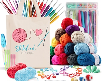 May include: A set of colorful yarn, crochet hooks, stitch markers, and other supplies for knitting and crocheting. The yarn is arranged in a pyramid shape, and the other supplies are scattered around it. The supplies are in a white tote bag with the words "Stitched with Love..." printed on it.