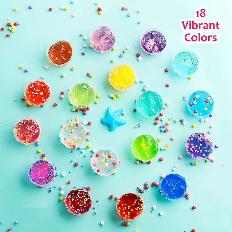 May include: An overhead shot of 18 vibrant colors of slime in small, clear containers. The slime colors include red, orange, yellow, green, blue, and purple, with colorful sprinkles and a blue starfish scattered around. Text reads "18 Vibrant Colors."