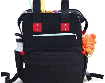 May include: Black canvas backpack with red accents and multiple pockets. The backpack has a top handle and adjustable shoulder straps. The backpack is filled with knitting needles and yarn.