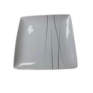 May include: A square, white ceramic plate with rounded corners. The plate features a minimalist design of thin, vertical black and gray lines. The lines are of varying lengths and create a subtle, abstract pattern across the surface.