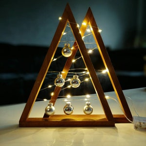 Christmas tree made of walnut/Fir tree made of wood illuminated with fairy lights and glass balls/Triangular tree