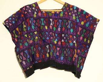 Vintage poncho: Coban Mayan huipil from Guatemala. Made on a backstrap loom with hand-made brocade, purple and pink