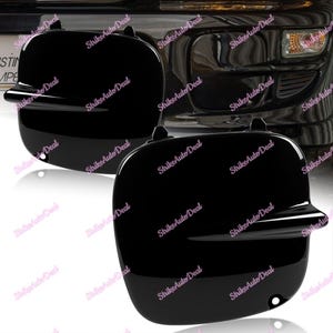 May include: A pair of black plastic car bumper covers. The covers are designed to protect the bumper from scratches and dents.
