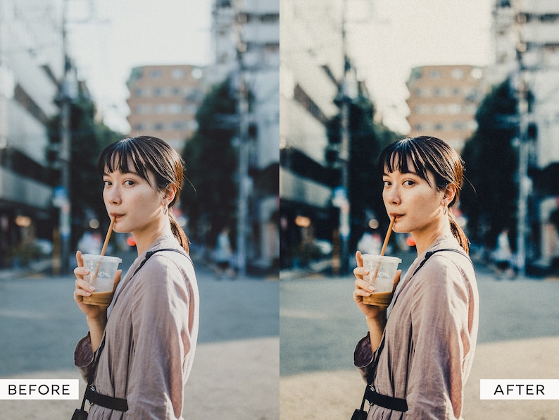 May include: A woman in a light brown jacket is drinking from a clear plastic cup with a straw. She is standing in a city street with buildings in the background.