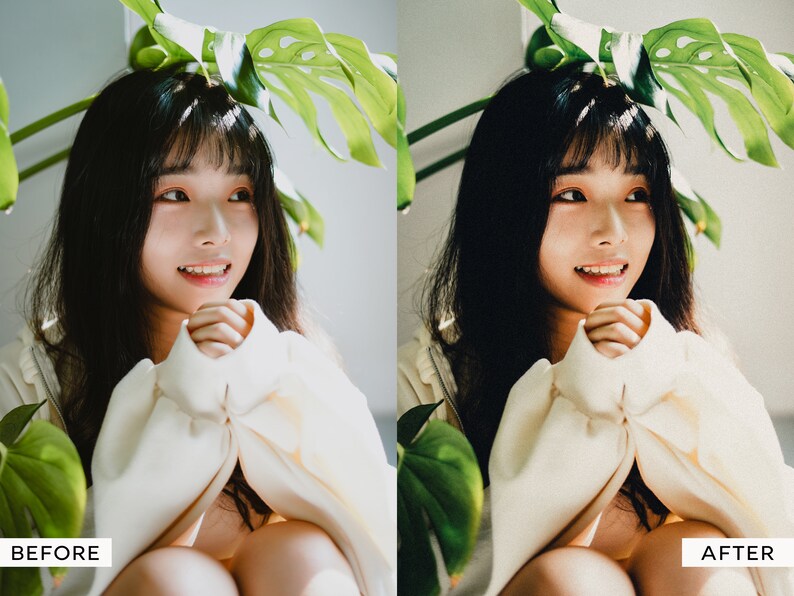 May include: A young person with long dark hair is wearing a white sweater and sitting with their hands clasped in their lap. The person is sitting in front of a green leafy plant.
