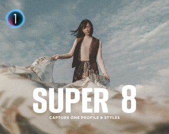 May include: A woman in a brown vest and floral skirt stands in front of a cloudy sky, holding a flowing fabric. The text "SUPER 8 CAPTURE ONE PROFILE & STYLES" is displayed below her.
