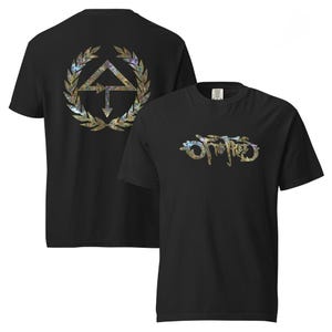 May include: Black t-shirts with iridescent designs. One shirt displays the text "Off The Trees" in a stylized font. The other shirt features a geometric design with an arrow and a laurel wreath. Both designs have a colorful, shimmering effect.