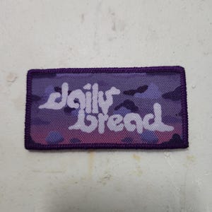 May include: A set of three ceramic mugs with a speckled, matte finish. The mugs are in shades of cream, light gray, and dark gray. Each mug has a simple, minimalist design, perfect for coffee or tea.