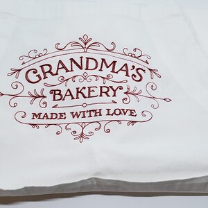 Apron White with Embroidered &quot;Grandmas Bakery Made with Love&quot; 2 Front Pockets