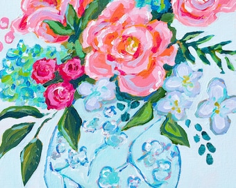 May include: A painting of a bouquet of pink, white, and blue flowers in a blue and white patterned vase. The flowers are arranged in a loose, natural style, and the vase is a classic Chinese design.