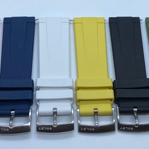 May include: Six different coloured watch straps with silver buckles. The straps are orange, blue, white, yellow, black, and green.