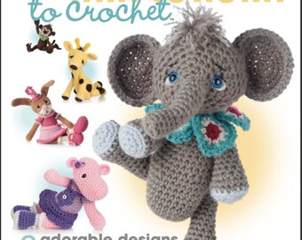 May include: A crochet pattern book featuring 8 adorable amigurumi animal designs. The cover features a gray elephant balancing on a ball. The book title is "Annie's Crochet Animal Amigurumi to Crochet".