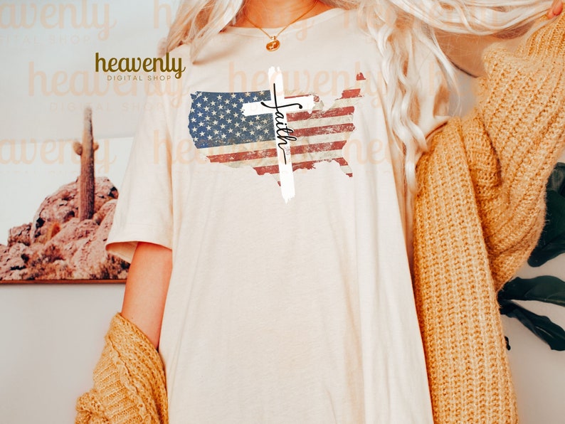 May include: A white t-shirt featuring a distressed American flag design and a white cross with the word "Faith" written on it.