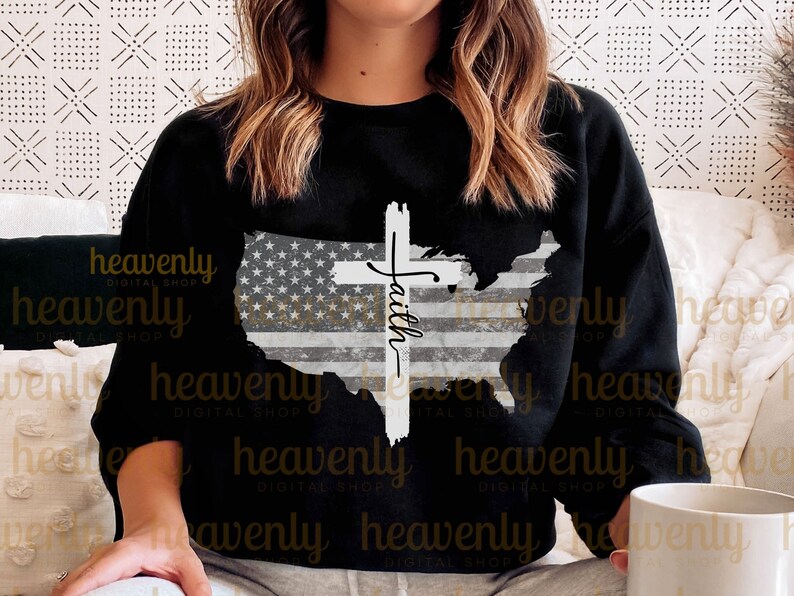 May include: Black sweatshirt featuring a distressed American flag design and a white cross with the word "Faith" written on it.