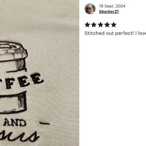 May include: A beige t-shirt with a black embroidered design of a coffee cup and the text "COFFEE AND Jesus".