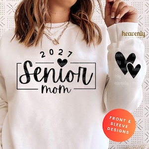 May include: White sweatshirt with the text "2027 Senior Mom" in black script and a heart design. The sleeve features two black hearts. The design is for front and sleeve designs.