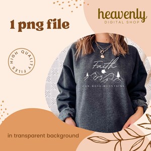 May include: A dark grey sweatshirt featuring the phrase "Faith Can Move Mountains" in white script, with a mountain graphic. The image also includes the text "1 png file" and "in transparent background". The shop name "heavenly DIGITAL SHOP" is also visible.