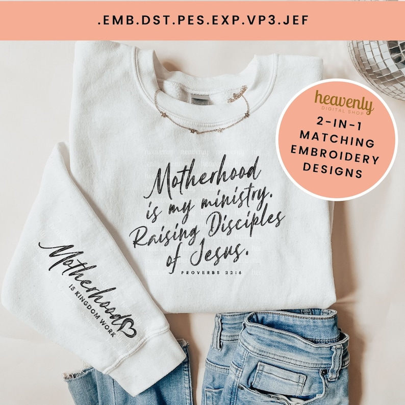 May include: White sweatshirt with the text "Motherhood is my ministry. Raising Disciples of Jesus. Proverbs 22:14" on the front and "Motherhood is Kingdom Work" on the sleeve. The sweatshirt is paired with blue jeans.