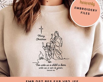 May include: A beige sweatshirt with a black line drawing of the nativity scene. The text "Merry Christmas" is above the image and the text "For unto us a child is born, unto us a son is given. ISAIAH 9:6" is below the image. The text ".EMB.DST.PES.EXP.VP3.JEF" is at the bottom of the image.
