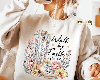 May include: A white sweatshirt with a colorful illustration of a cowboy boot with flowers and the text "Walk by Faith 2 Cor. 5:7".
