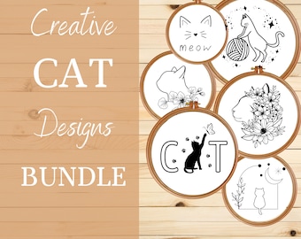 May include: A set of six embroidery hoop designs featuring black and white illustrations of cats. The designs include a cat with a flower crown, a cat with a ball of yarn, a cat with the word "meow" and a cat with the word "CAT".