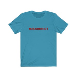 May include: A turquoise blue t-shirt with the word "MISANDRIST" printed in red on the front.