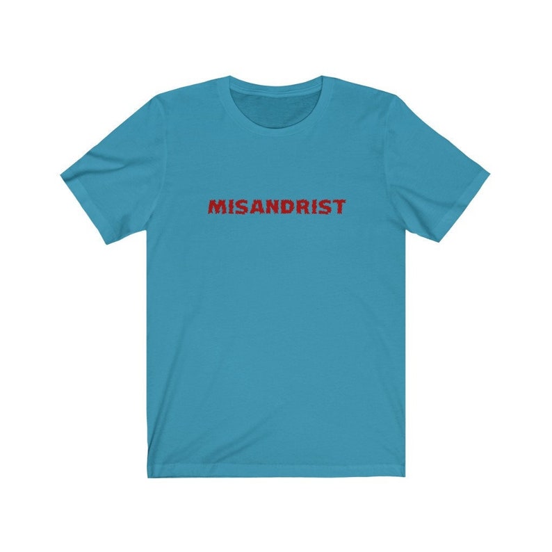 May include: A turquoise blue t-shirt with the word "MISANDRIST" printed in red on the front.
