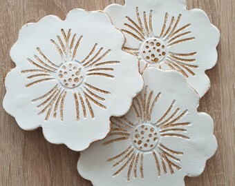 Wall hanging flowers decoration handmade of air-drying clay for modern or minimalist interiors. Coaster for cups or holder for jewelry, keys