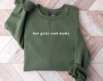 May include: A dark green sweatshirt with the text "hot girls read books" in white.