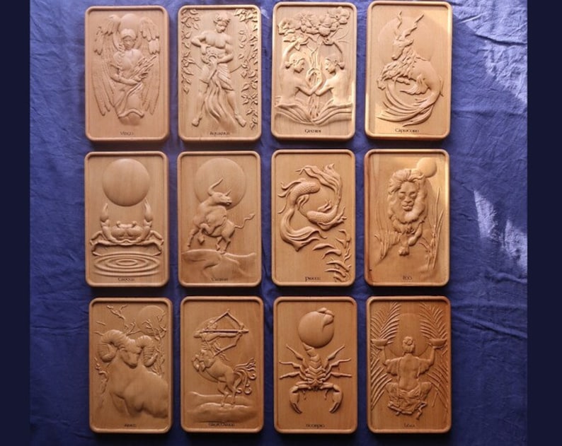May include: Twelve wooden plaques with zodiac signs carved in relief. Each plaque features a different zodiac sign, including Aries, Taurus, Gemini, Cancer, Leo, Virgo, Libra, Scorpio, Sagittarius, Capricorn, Aquarius, and Pisces.
