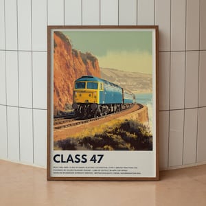 Puede incluir: Un póster enmarcado que muestra una locomotora diésel-eléctrica Clase 47. El tren azul y amarillo está en una vía férrea a lo largo de un acantilado costero. El póster incluye el texto "CLASS 47" y detalles técnicos.