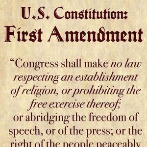 May include: A parchment-style document with the text "U.S. Constitution: First Amendment" in a dark red, ornate font. The text includes the First Amendment's clauses on freedom of religion, speech, and the press.