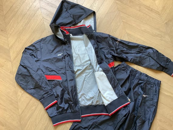 Asics wind jacket hotsell