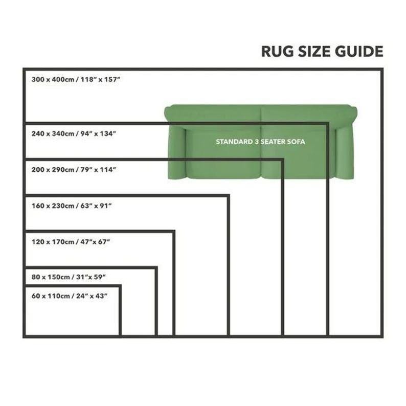 May include: A rug size guide with a standard 3-seater sofa illustrated. The guide shows different rug sizes in inches and centimeters, ranging from 24" x 43" to 118" x 157".