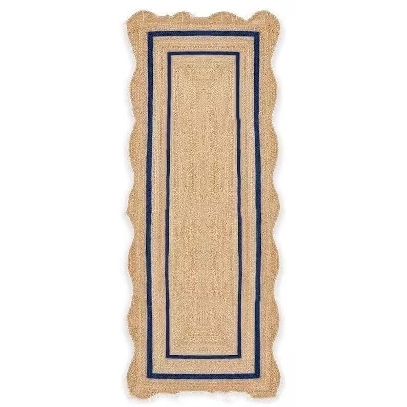 May include: A rectangular jute runner rug with a scalloped edge. The rug features a natural tan color with a navy blue border and a rectangular navy blue inner design. The rug is designed for indoor use.