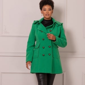 May include: A green double-breasted peacoat with a hood. The coat has four large buttons and two pockets.
