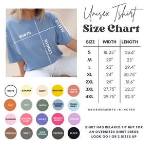 May include: A light blue unisex t-shirt with a size chart. The chart lists measurements in inches for sizes S to 4XL. Color options include white, banana, ivory, mustard, terra-cotta, yam, bay, moss, washed denim, chambray, blossom, watermelon, violet, crunch berry, orchid, espresso, grey, blue spruce, pepper, and black.