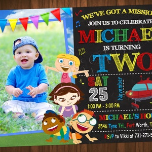 May include: A birthday invitation for a boy named Michael turning two. The invitation features a photo of Michael, a red spaceship, and characters from the children's show 'The Backyardigans'. The invitation is decorated with colourful flags and musical notes. The text on the invitation reads: "We've got a mission! Join us to celebrate Michael is turning two. Sat 25 November 1:00 PM - 3:00 PM Michael's House 2546 Tyne Trl., Fort Worth, TX 72456 RSVP to Vikki at 731-271-5253"