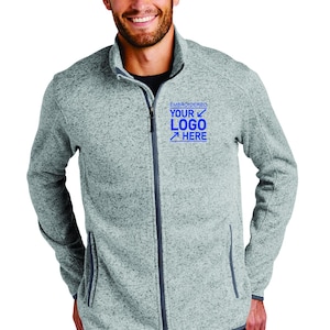 May include: A gray heather zip-up fleece jacket with a blue embroidered logo that says "Embroidered Your Logo Here".