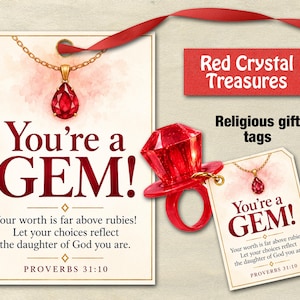 May include: Two rectangular gift tags featuring a red teardrop pendant illustration and the text You're a GEM! Your worth is far above rubies! Let your choices reflect the daughter of God you are. PROVERBS 31:10. A red plastic ring is included.
