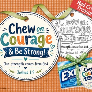 May include: A gift set featuring a round tag with the text "Chew on Courage & Be Strong!" in blue, green, and orange. The set includes a pack of gum tied with a green ribbon and a matching tag. The background is a checkered pattern.