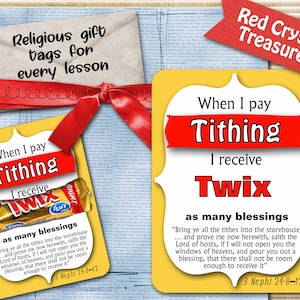 May include: Yellow and red printable gift tag with the text "When I pay tithing I receive Twix as many blessings" and a scripture quote from 3 Nephi 24:8-12. The tag features a Twix candy bar.