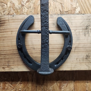 Railroad spike horseshoe door knocker