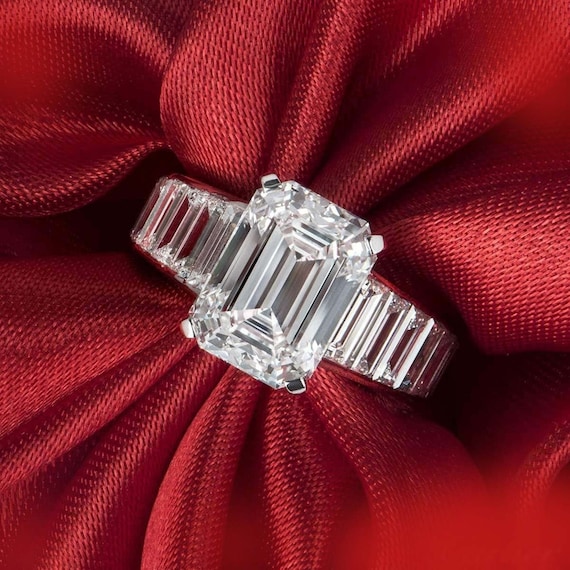Rectangle Cut Cubic Zirconia Solitaire Ring with Baguette Side Accents Rhodium on Sterling Silver Rectangle Cut Cubic Zirconia Solitaire Ring with Baguette Side Accents Rhodium on Sterling Silver
