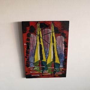 May include: Abstract painting of two yellow sailboats with black outlines and rigging against a red background. The painting has a rectangular shape and features a mix of colors, including yellow, red, blue, and purple.