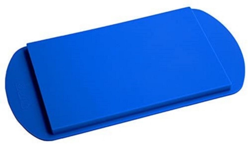 May include: A bright blue silicone baking sheet with a raised edge. The sheet is rectangular with rounded corners.