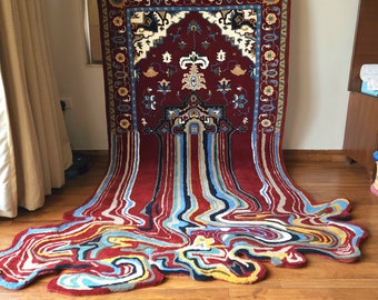 May include: A traditional red, blue, and yellow patterned rug with a flowing, liquid-like design. The rug is made of wool and has a high pile.