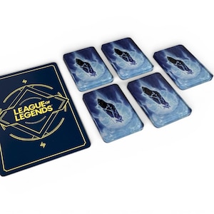 May include: A dark blue rectangular card featuring the yellow League of Legends logo and geometric lines, accompanied by five smaller rectangular cards displaying a blue and white graphic of a dark crystal surrounded by swirling energy.